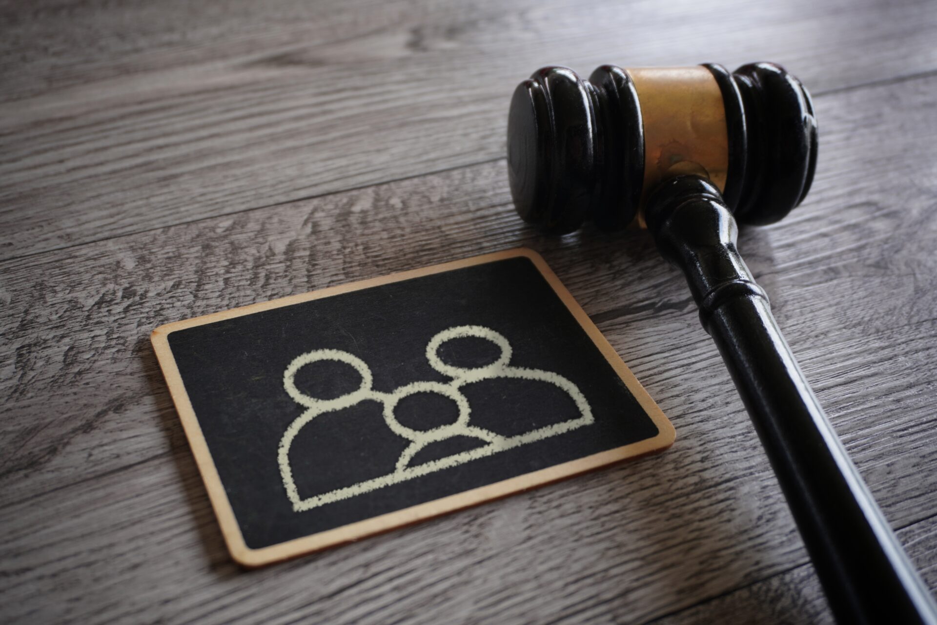 Image of a judges gavel and chalkboard with family icon
