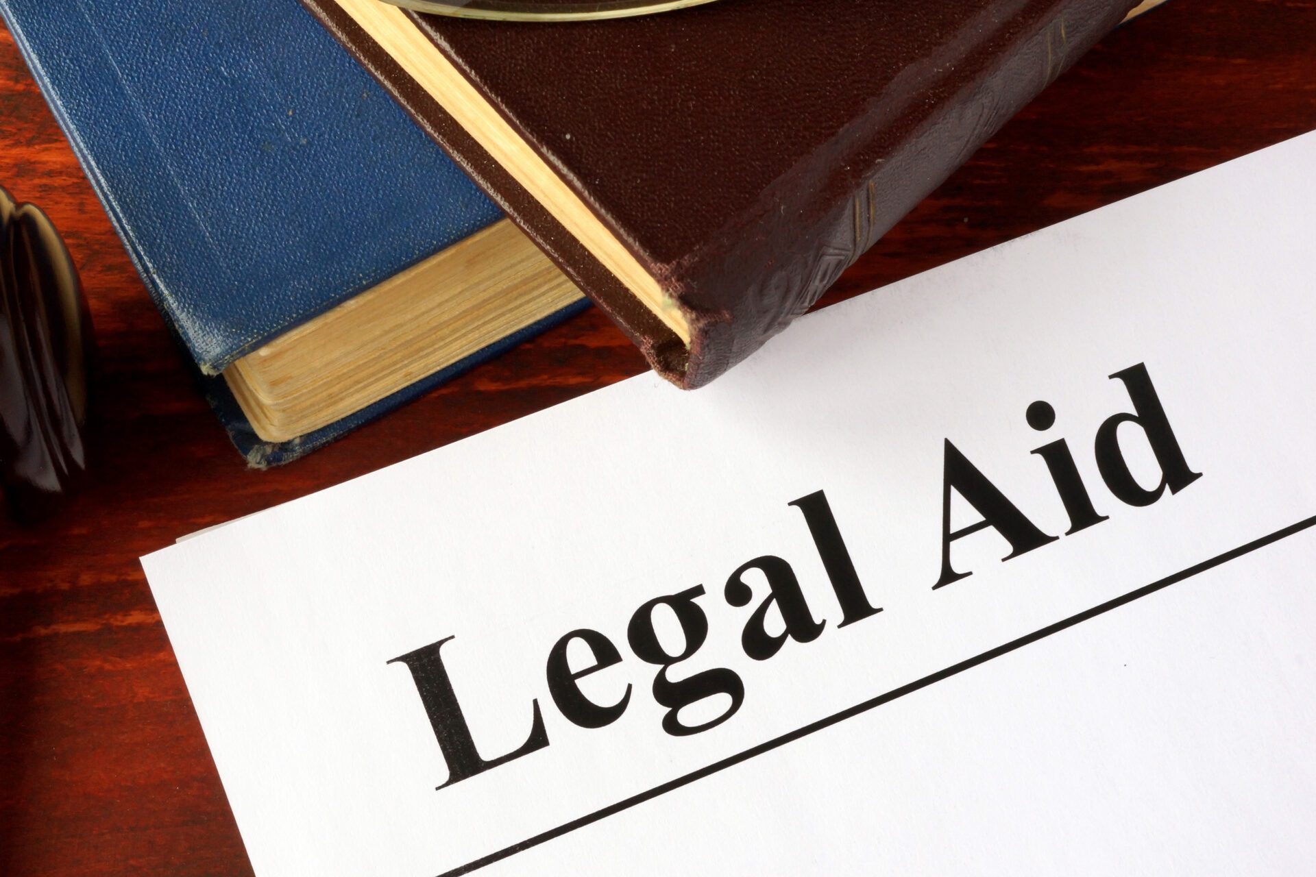 Image of papers with title legal aid on a table